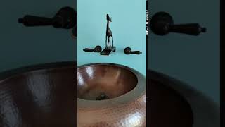 Buck bronze faucet over waterfall