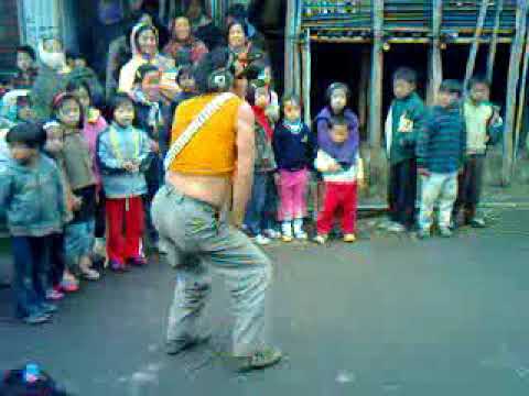 Modern day VJ performing comical dance stances entertaining at apatani village