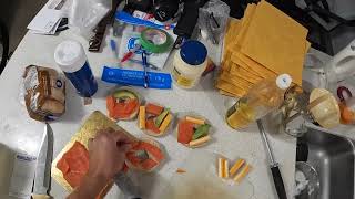 Captain Sergei makes a poached egg sandwich with smoked salmon, cheese, and avocado.
