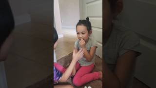 Cousin shows Teresa how to make her loose tooth fall out. #kids #funny #shorts