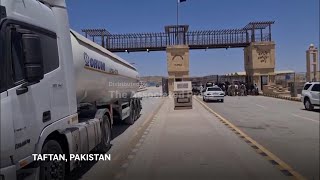 Pakistani nationals fleeing Iran cross the land border at Taftan
