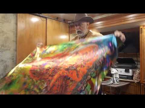 Tom steams a picture of the Buddha printed on Satin.