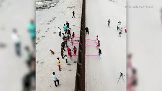 Seesaw installation brings children together on both sides of the border | ABC7