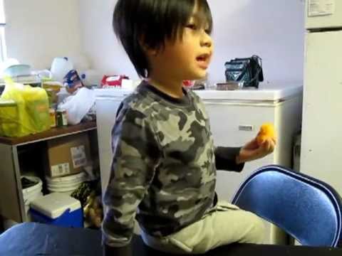 Hmong Boy Eats Nemo in a shanty Hmong House