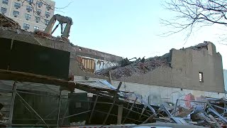 Part of vacant building collapses onto scaffolding below in the Bronx