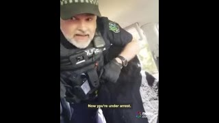 Wild moment cops smash in a 'sovereign citizen's' car