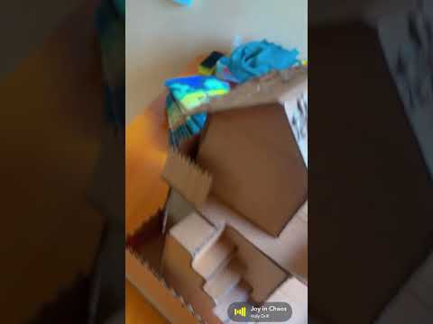 A story building crafted with biscuits carton