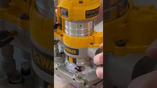 Pulling out the DeWalt router to add a key hole to the back of the walnut and purpleheart cross.