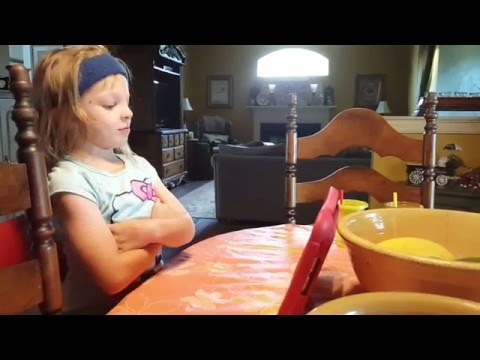 Little Girl Talking to Siri on her iPad