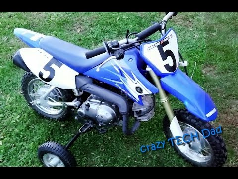 EZ How to access or replace the battery on a Yamaha TTR50.