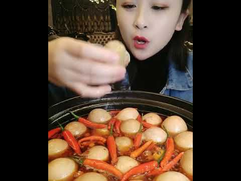 Eating balut and drinking the soup inside it.