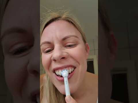 Electric toothbrushing with toothpaste