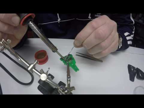 Saab Key Repair - Soldering the unlock button backonto the circuit board !