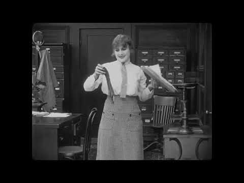 The Bank (1915) - Charlie Chaplin hugs up the big Monkey Man with Toots and the Maytals