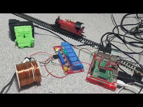 Operating a model train using a relay system and a r-pi