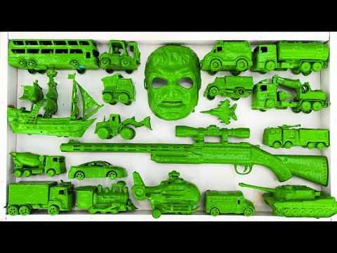 cleaning toy racing cars, dump trucks, trains, school buses, sand trucks, tractors