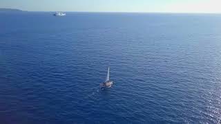 Sailboat Journeys Through Blue Ocean Water | Free + Royalty Free Video | FreeVideoDownload