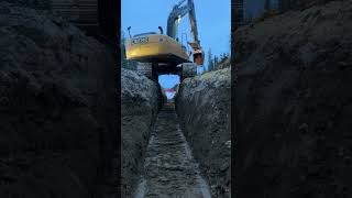 Hopping Off Ditch in an Excavator