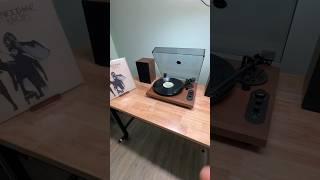 Vinyl record player with speakers and Bluetooth transceiver