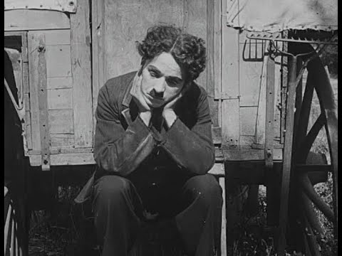 "The Vagabond" (1916)   Charlie Chaplin has "Many Rivers to Cross" with Jimmy Cliff
