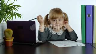 Preschool Child Girl Distance Online Learning at Home. Kid Studying Using Digital Laptop Compute...