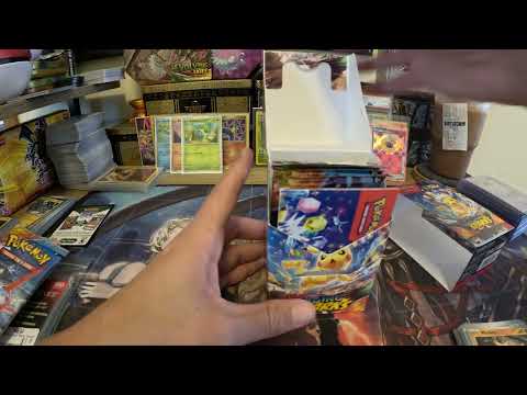 Opening 9 packs of Surging Sparks 2 week Early?!?!? (Pulling a Gold Card)