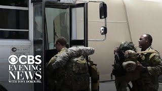 Tensions flare as Trump surges military assets and Iran warns of retaliation