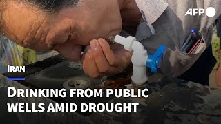 Iranians drink from public wells as water crisis bites | AFP