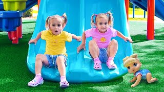 Alice and Baby Doll play on the Outdoor Playground