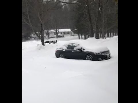 Car buried in snow