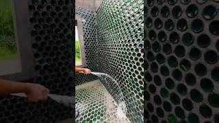 Next Level Recycling A House Made of Glass Bottles