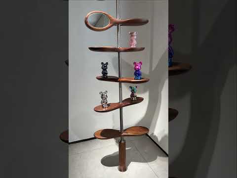 Rotating Propeller Shaped shelving unit.