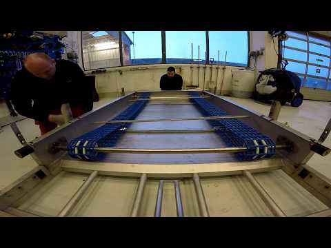 Adjusting scraper belt on the MudCube