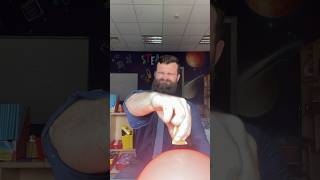 Popping a balloon with an orange 🍊 #scienceexperiment #coolexperiments #learningmadefun