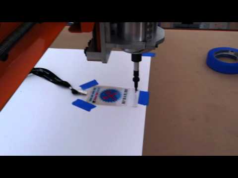 Plotting name on card on my DIY CNC at Makerfaire Detroit