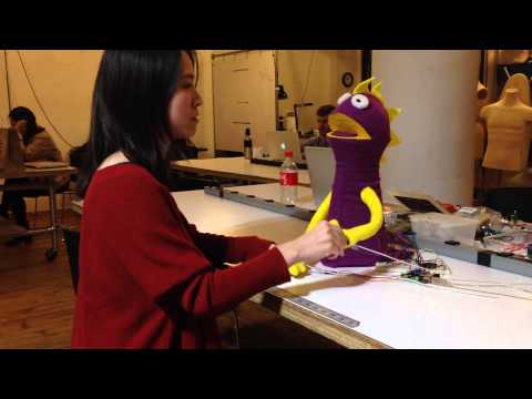 Hand puppet with force sensors and speaker