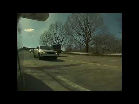 Driver risks a collision to save a few minutes waiting at a light