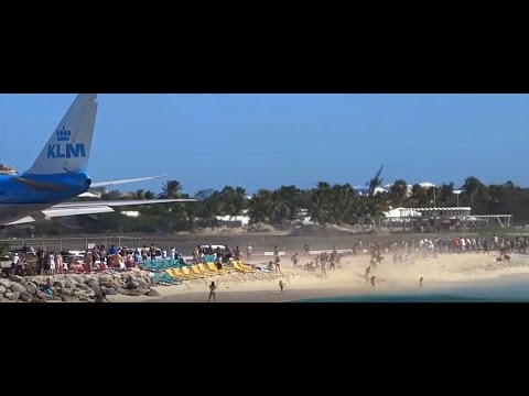 Plane takes off blowing people on the beach into the water! INSANE