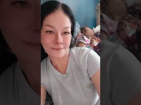 Cozy Moments: Child Relaxing with a Bottle#CozyMoments #ChildCare #RestTime #Peaceful