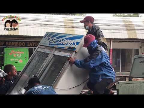 Thailand Charity Preparing a New Food Pantry Using an Old Fridge