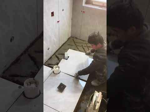 Watch a Bricklayer Laying Tiles at a Real Construction Site