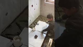 Watch a Bricklayer Laying Tiles at a Real Construction Site