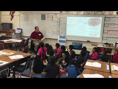 Shoe Carnival District Operations Manager, James Jones, Reads to Montclaire Elementary Students
