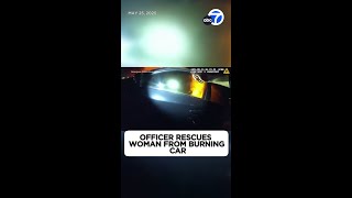 Dramatic video shows officer rescue woman from burning car