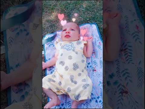 Newborn Baby Out In The Park Enjoying Summer