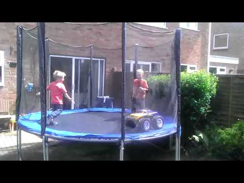 Kids on a trampoline with an RC truck