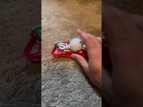 Putting a golf ball on a bag of skittles