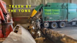 Watch Garbage trucks dumping Tons of Trash in the Hole!