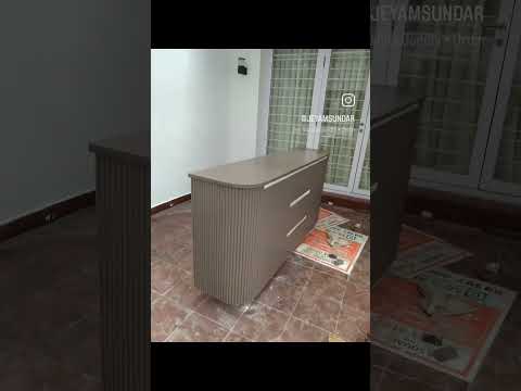 Banglow interior. Crockery unit. corian top chocolate colour finish with duco.