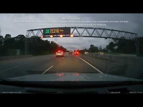 At least pull over completely and use your lights